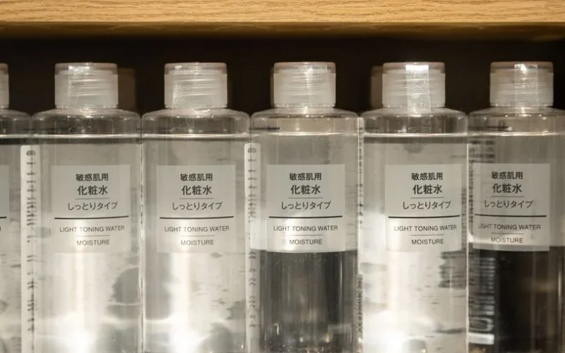 Close-up of Muji light toning water moisture bottles on a shelf.